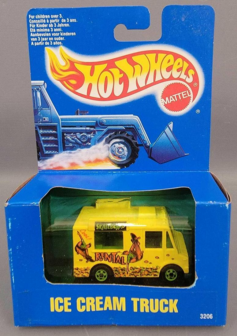 Hot Wheels Yellow Ice Cream Truck in Canadian Box: Hot Wheels Yellow Ice Cream Truck in Canadian Box. Truck is minty in a good condition box that has a yellowed window and some light shelf wear in spots. As seen in the photos.