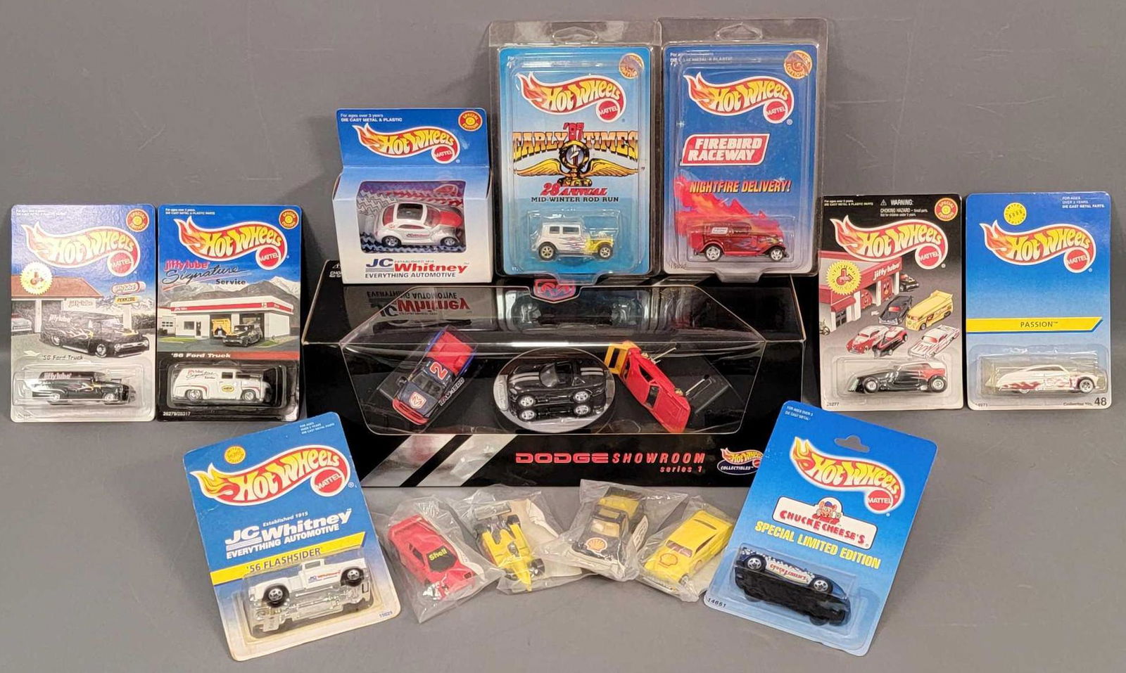 Group of 11 Hot Wheels LE vehicles on Blister Packs: Group of 11 Hot Wheels LE vehicles on Blister Packs. Assorted group of LE cars, all are minty on very good cards with light shelf wear in a few places. Four of the cars are the Shell promo cars that a
