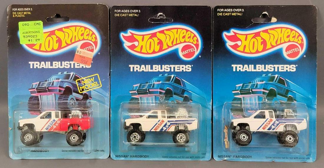 Group of 3 Hot Wheels Nissan Hardbody 4x4 Trucks on: Group of 3 Hot Wheels Nissan Hardbody 4x4 Trucks on Blister Packs. Cars are minty on fair cards that have edge wear and dings. Blisters are clean and clear with no cracks and are all firmly attached.