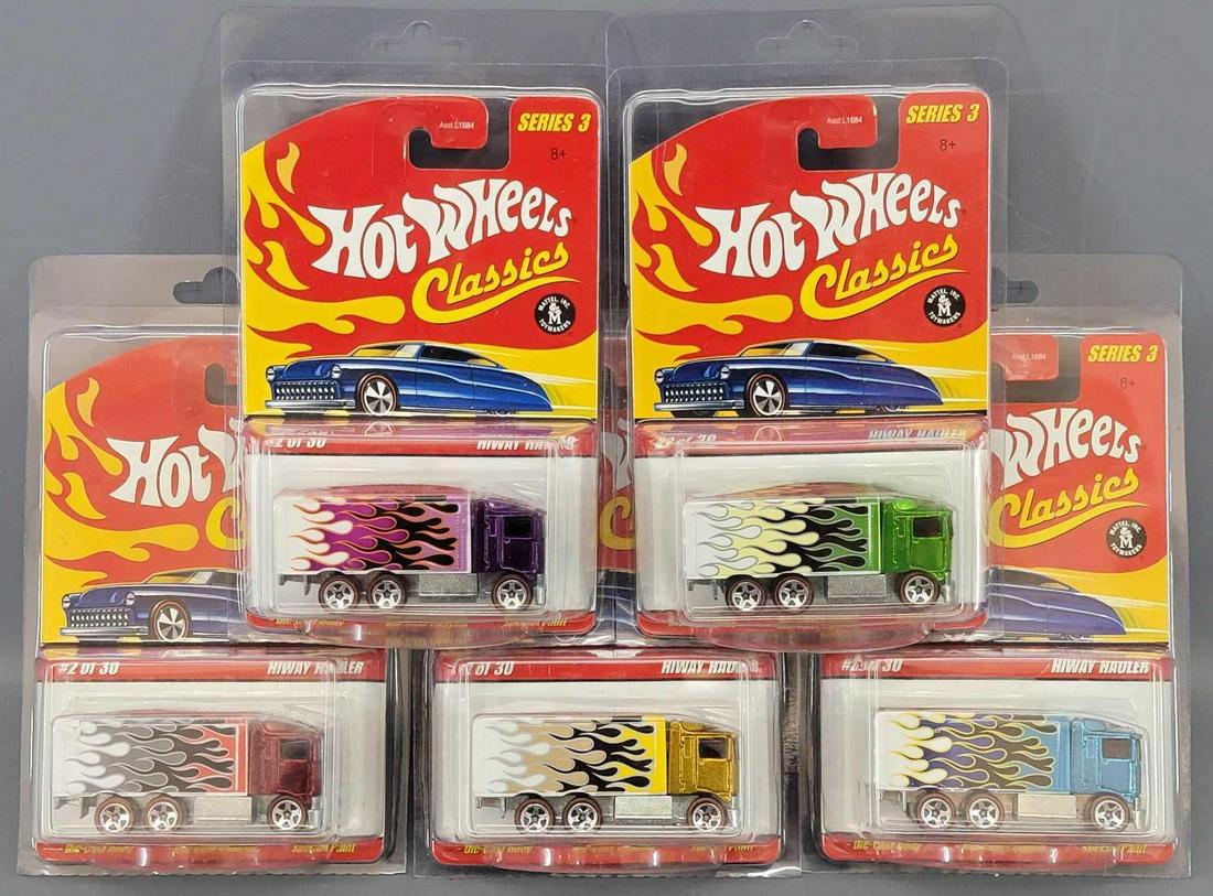 Group of 5 Hot Wheels Classics Hiway Haulers Blister: Group of 5 Hot Wheels Classics Hiway Haulers Blister Packs. All cars are minty in very good blister packs. Trucks included are blue , gold, green, purple and red. All 5 come in protectors. As seen in