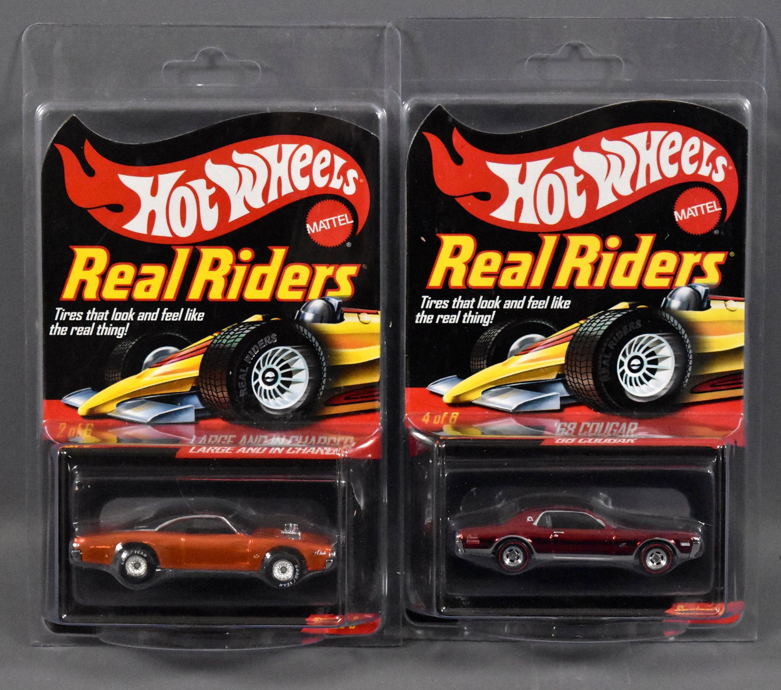Two Mattel Hot Wheels Real Riders Redline Club cars MOC: Two Mattel Hot Wheels Real Riders Redline Club cars to include '68 Cougar plus Large And In Charger, mint on sealed blister cards with protecto packs.