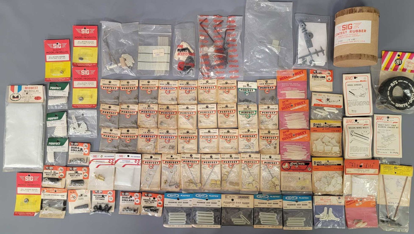 Group of mixed model airplane hardware parts: Group of mixed model airplane hardware parts from manufactures including Perfect, Midwest, and Dubro. Sold as-is as seen in the photos with no returns.