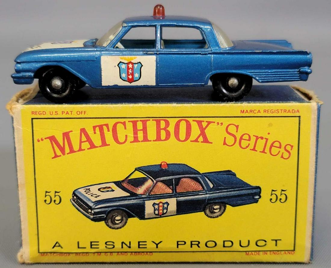 Lesney Matchbox #55 Police Patrol Car in original box: Lesney Matchbox #55 Police Patrol Car in original box. Car is near mint except there is damage to the hood decal as seen, it has black wheels, it is in a very good box though the inside flap of one en