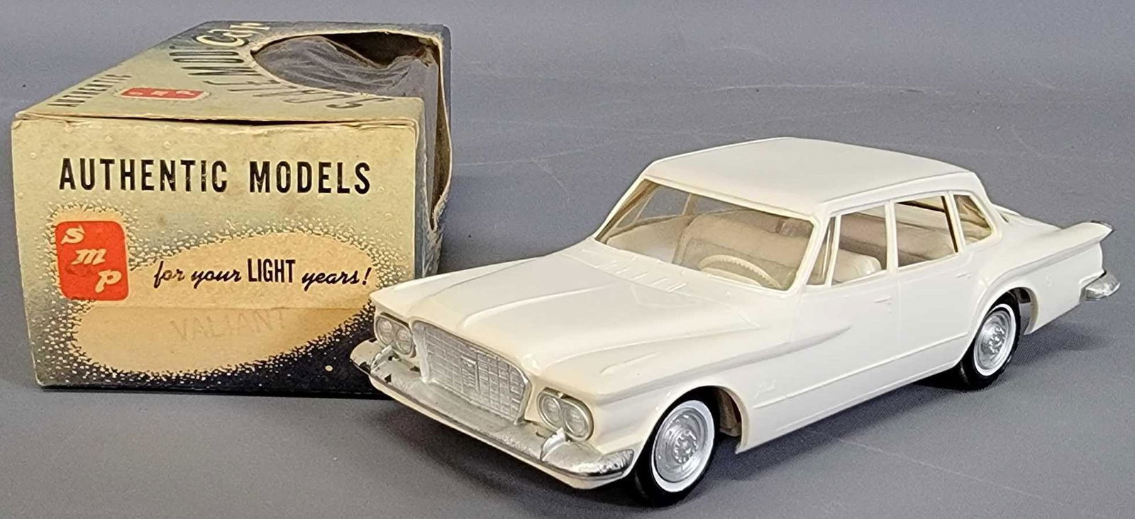 1960 Plymouth Valiant coaster promo car in original: 1960 Plymouth Valiant coaster promo car in original box, excellent condition with a slightly rough straight line on the roof but displays nicely.