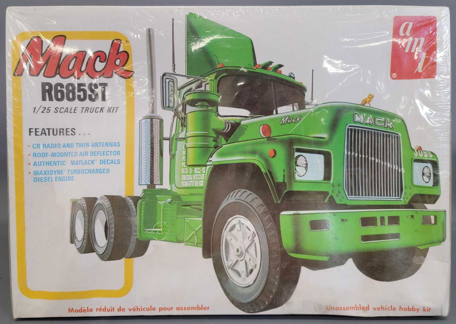 Factory Sealed AMT Mack R685ST 1:25 scale model kit: Factory Sealed AMT Mack R685ST 1:25 scale model kit T535. Box is fair as it has severe cupping on all sides, also has some light water stains along one edge and corner, plastic has a small tear in one