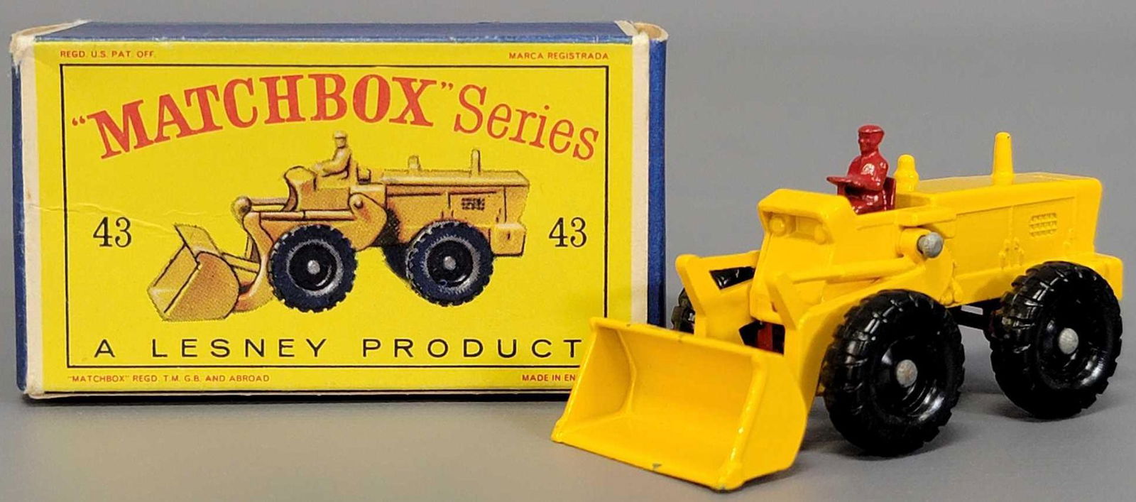 Lesney Matchbox 43 Aveling-Barford Tractor Shovel in: Lesney Matchbox 43 Aveling-Barford Tractor Shovel in original D series box. Tractor is excellent with just a few chips on the shovel edges, the box is very good with some small tears to the end flap h