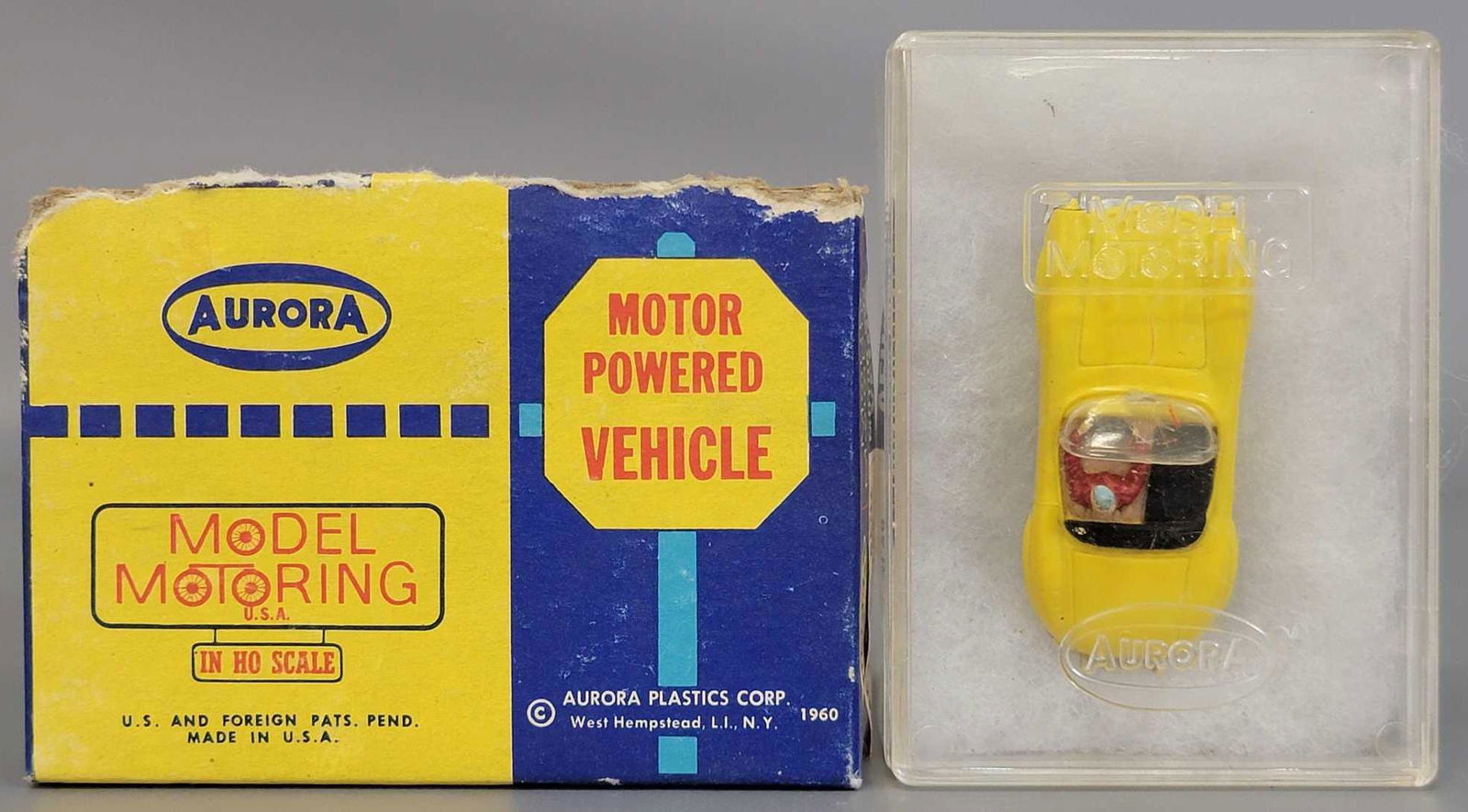 Aurora Model Motoring Vibrator Yellow 1542 Mercedes: Aurora Model Motoring Vibrator Yellow 1542 Mercedes Benz Slot Car in original box . The car is in overall very good condition but the rear rubber tires have become deformed with age, and there is some