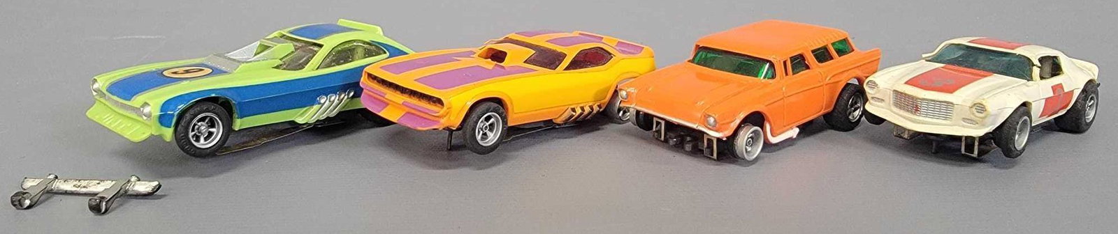 Group of Four Aurora AFX Slot Cars Camaro Pinto Nomad: Group of Four Aurora AFX Slot Cars Camaro Pinto Nomad . Camaro is complete but has 2 broken pillars, Pinto drag car is nice but rear bumper is off and missing a taillight piece, Nomad is missing both 