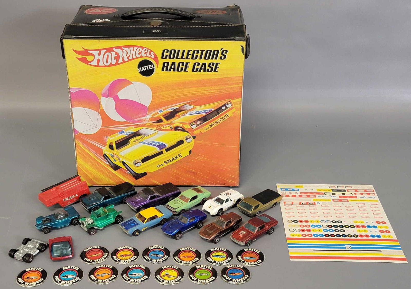 Hot Wheels Redline 72 car case with twelve Redline cars: Hot Wheels Redline 72 car case with twelve Redline cars and Buttons included. Case is in poor to fair condition with corner splits and small tape repairs , it does have 6 solid, clean trays with only