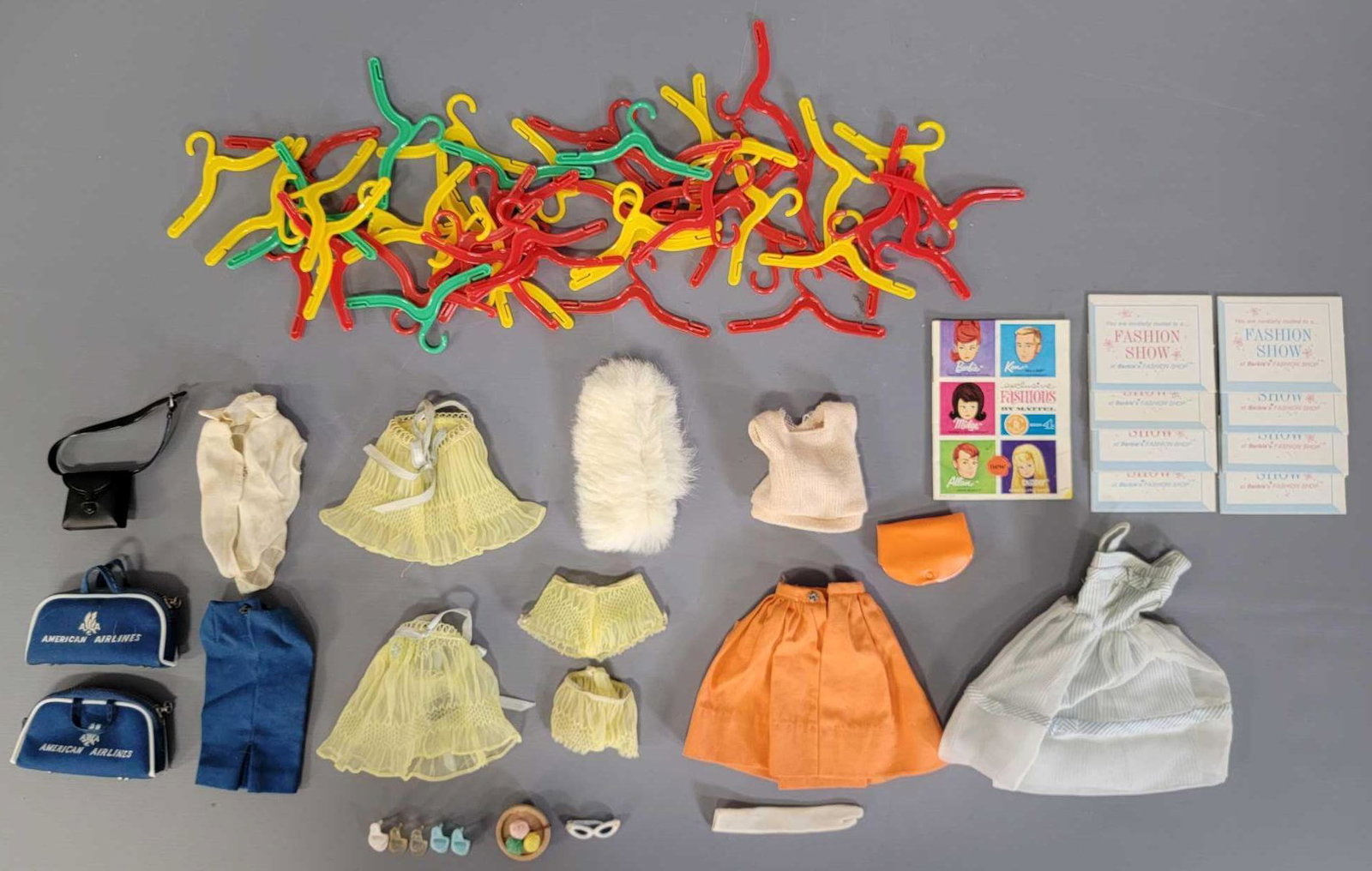 Vintage Mattel Barbie assorted clothing and 50 off: Vintage Mattel Barbie assorted clothing and 50 off brand hangers, various condition on clothing from good to near mint as seen in the photos.