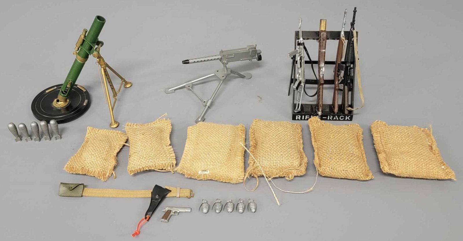 Great grouping of vintage Hasbro GI Joe guns weapons: Great grouping of vintage Hasbro GI Joe guns, weapons and more. Highlight is the 81mm mortar setup but also includes rifles, pistol, grenades a rifle rack, sandbags and more. Sold as-is as seen in the