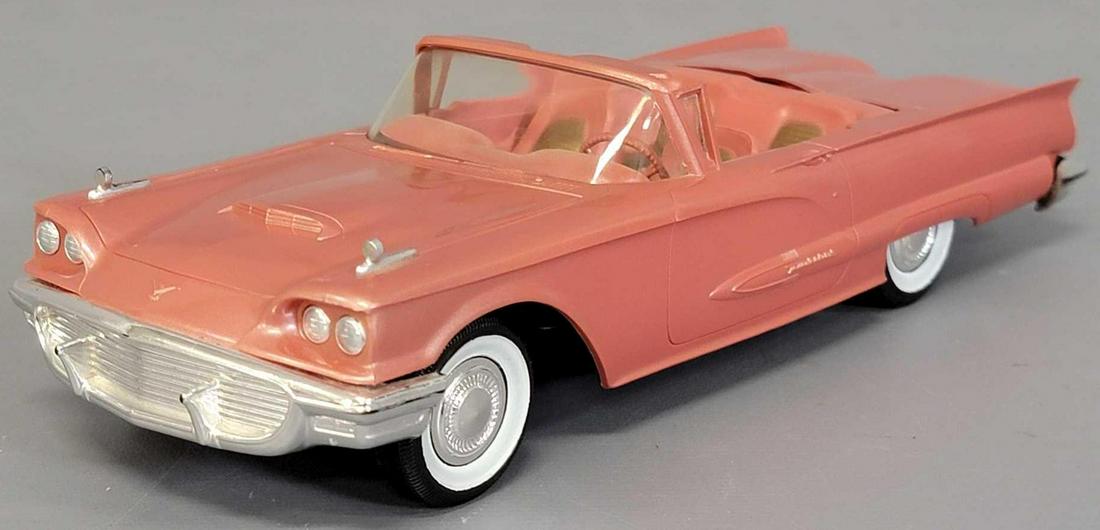1959 Rose metallic Thunderbird Convertible dealer promo: 1959 Rose metallic Thunderbird Convertible promo car. Car is to very good excellent with some very light warping in spots, light paint wear on bumpers and a few minor paint blemishes. Sold as-is as se