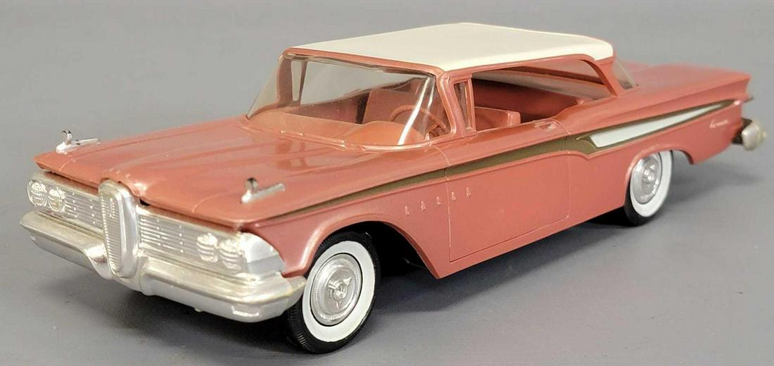 1959 AMT Red/white Edsel Hardtop Convertible friction: 1959 AMT Red/white Edsel Hardtop Convertible friction promo car. Car is excellent plus with very light body warp a very minor windshield bow at the top edge and light chrome wear on the bumpers. Sold 