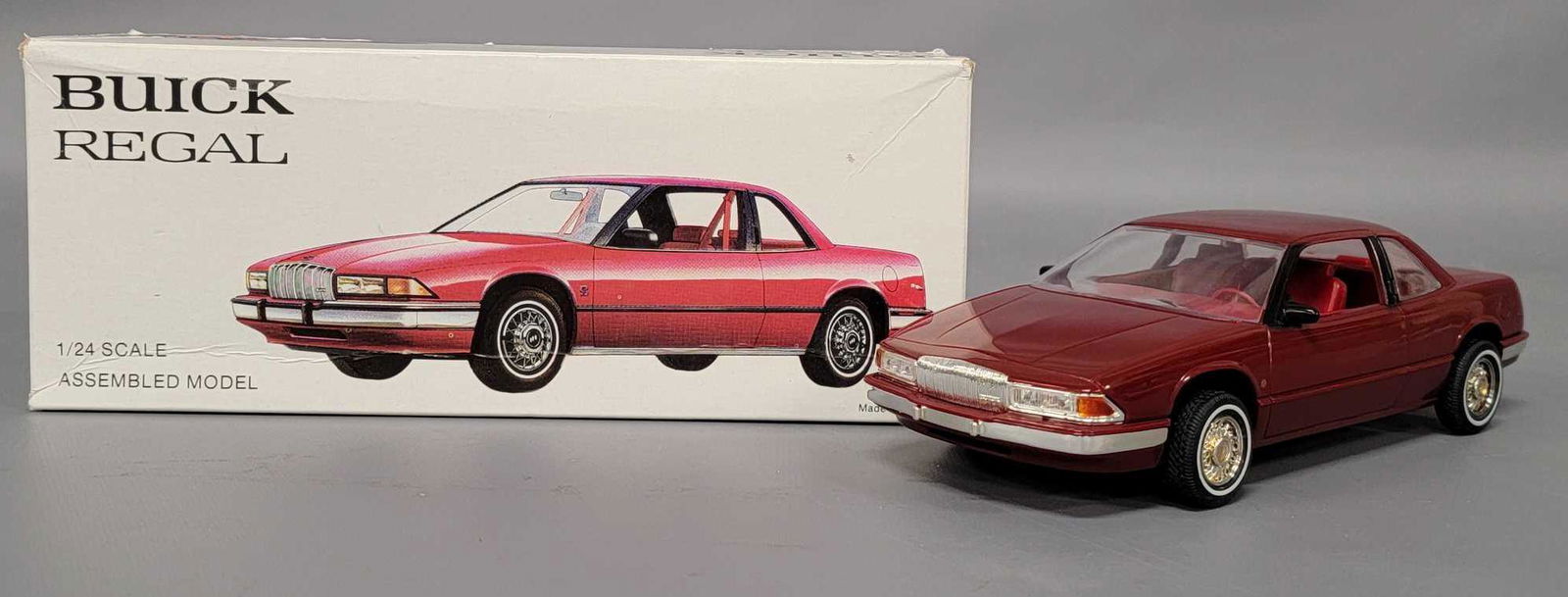 1988 Buick Regal 1/24 scale promo car in original box: 1988 Buick Regal 1/24 scale promo car in original box, mint and never removed in a very good original box with a stain on one side as seen in the photos.