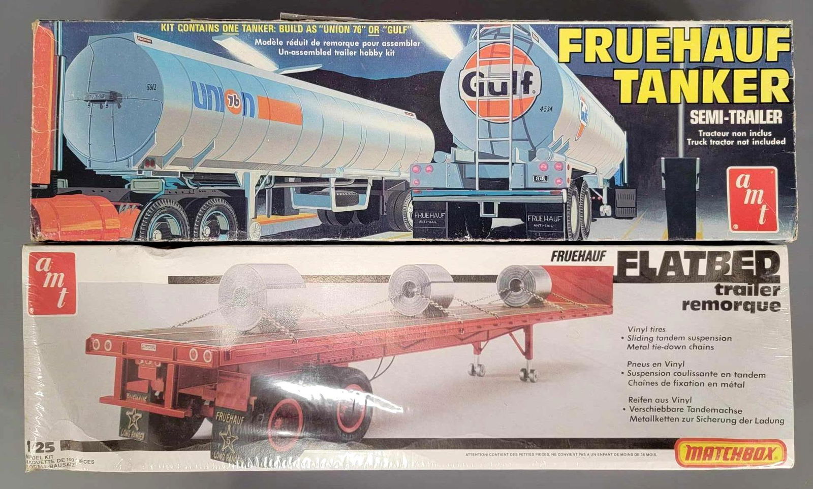 Two semi trailer kits in original boxes Fruehauf: Two semi trailer kits in original boxes Fruehauf tanker is tank only, no frame. Flatbed trailer is sealed. Both are AMT. Please view photos, sold as is shown with no returns.