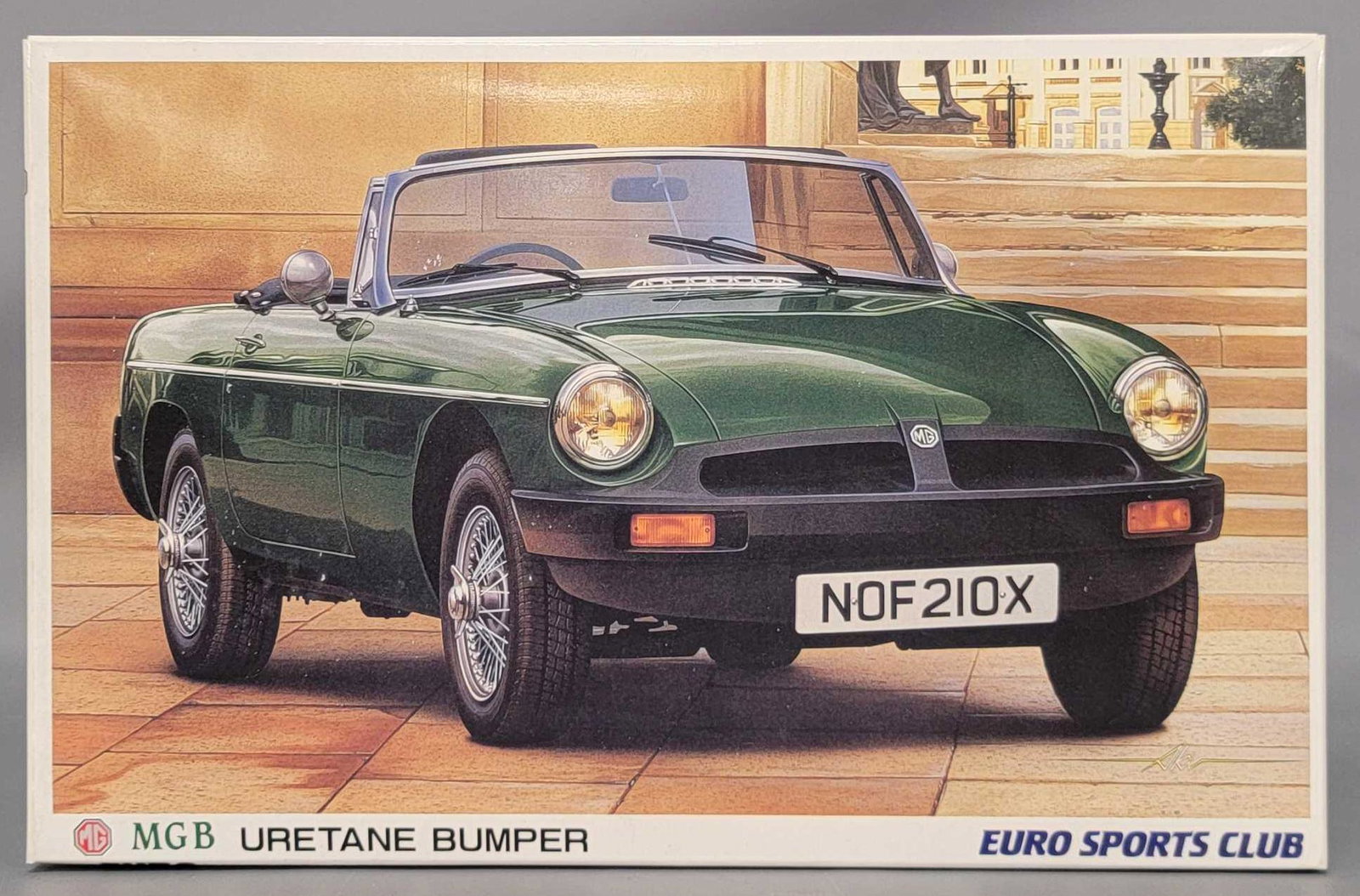 Unbuilt Aoshima Euro Sports Club MGB Uretane Bumper: Unbuilt Aoshima Euro Sports Club MGB Uretane Bumper 1/24 scale model kit. Kit appears to be complete with all parts still in unopened baggies along with decal and instruction sheets. Box lid is in exc