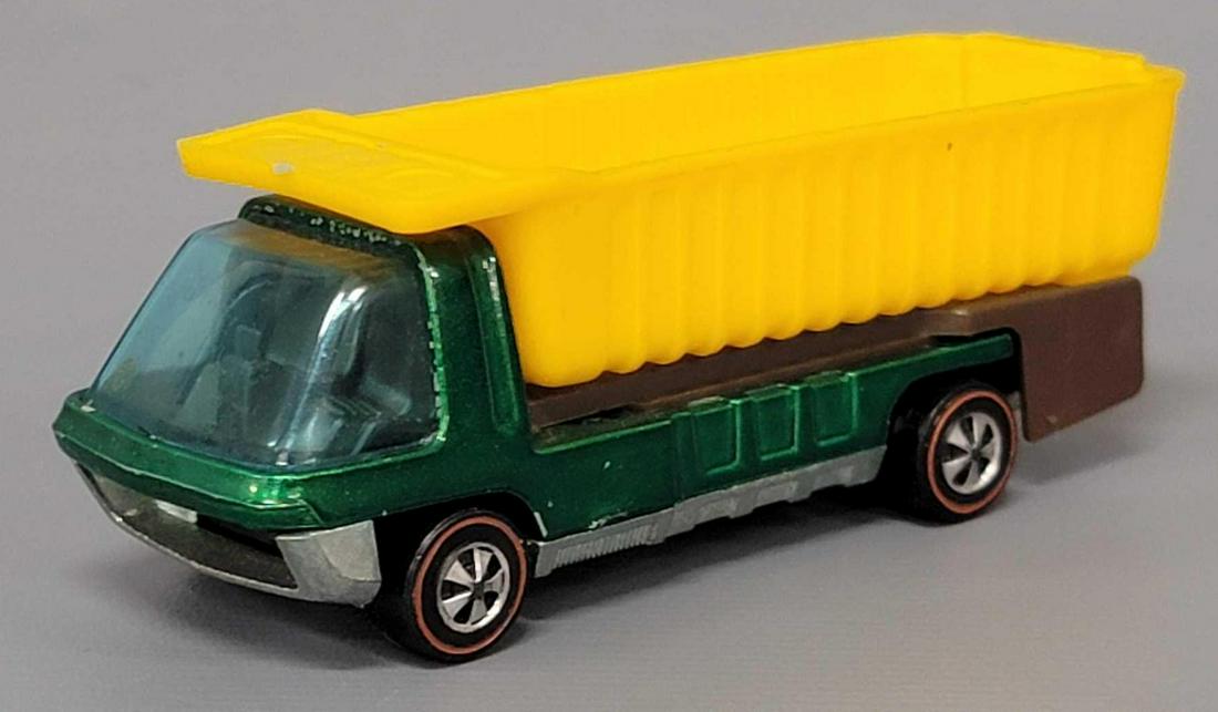 Hot Wheels Redline Heavyweights Green Dump Truck: Hot Wheels Redline Heavyweights Green Dump Truck. Car is excellent with very light edge wear in spots, glass has light marks but no cracks, excellent wheels, super clean base.