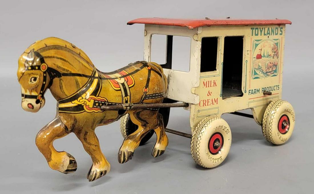 Marx Toyland's Farm Products, Milk & Cream tinplate: Marx Toyland's Farm Products, Milk & Cream tinplate windup horse drawn wagon, in working condition. Toy appears to be in very good to excellent condition.
