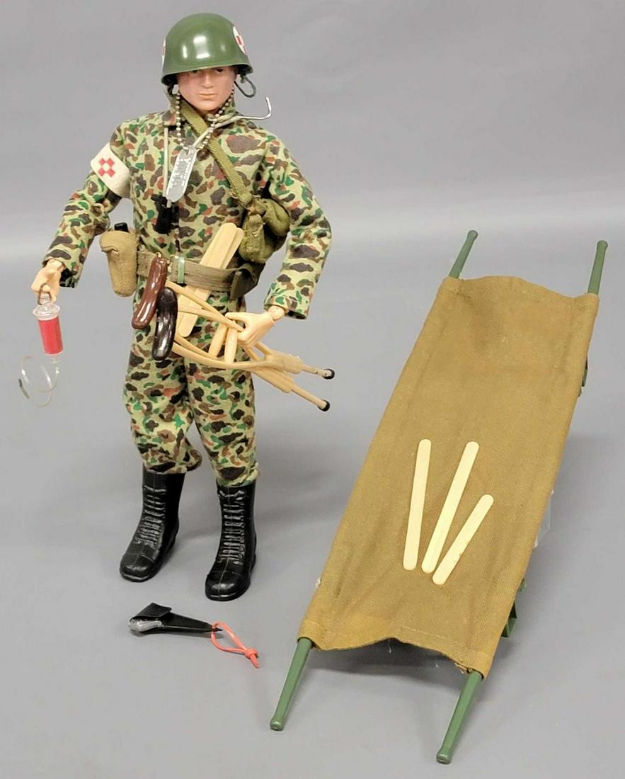 Vintage Hasbro GI Joe Action Marine Medic with: Vintage Hasbro GI Joe Action Marine with Medic accessories. Body has cracks at hips, knees, calf. TM Patent Pending torso. Light play wear to body and head. Shirt and pants are marked, TM Japan. Steth