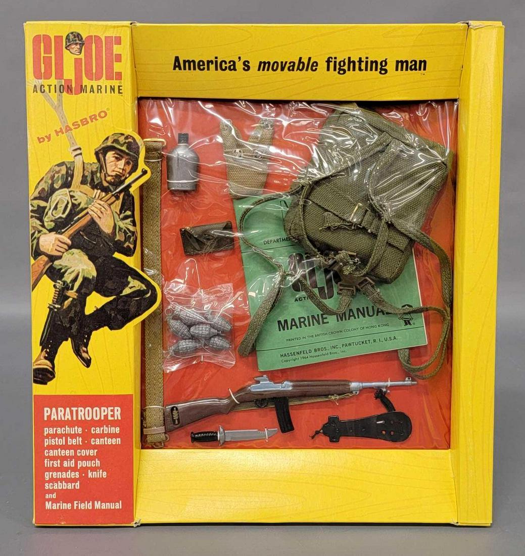 Vintage Hasbro Action Marine GI Joe Paratrooper on: Vintage Hasbro Action Marine GI Joe Paratrooper on window box 7705. Cellophane is untorn, but has a supe tiny poke at a backpack button. Package looks like new. Box is marked British Crown Colony of H