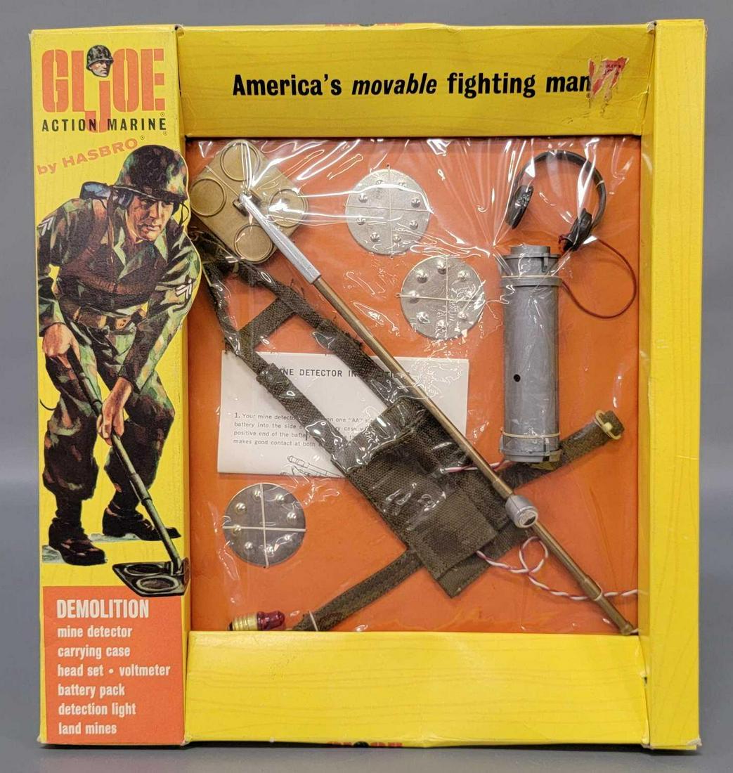 Vintage Hasbro Action Marine GI Joe Demolition equip on: Vintage Hasbro Action Marine GI Joe Demolition equipment on window box 7730. Box has some slight crushing to display window top and bottom. Cellophane has small tears at top and bottom of battery pack