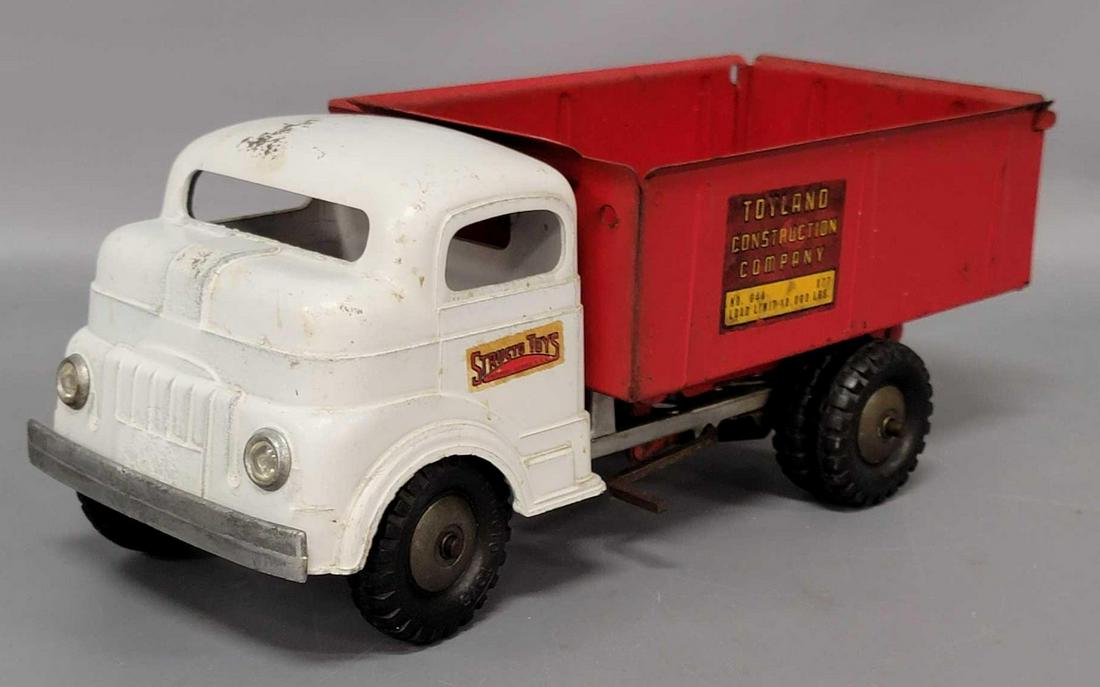 Structo pressed steel die cast cab over Toyland: Structo cab over Toyland Construction Co dump truck. Bed is pressed steel, chassis and cab are die cast. Truck has loss of paint on cab roof, cleaned rust in bed. Windup motor works very well.