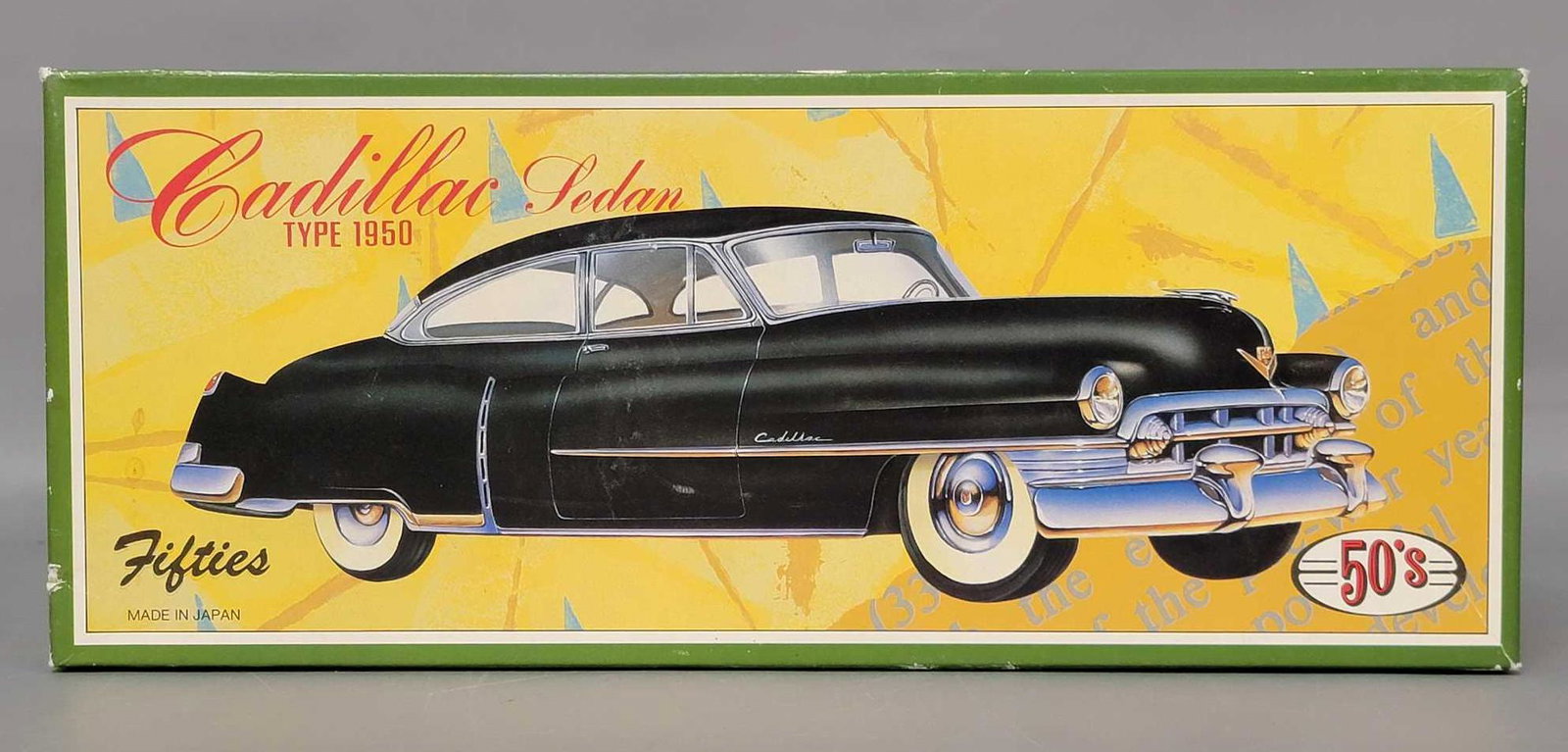 Fifties Cadillac Sedan type 1950 friction powered car: Fifties Cadillac Sedan type 1950 tinplate lithographed friction powered toy car in original box with certificates of title paper literature. Car looks clean and shiny. Box shows no wear.