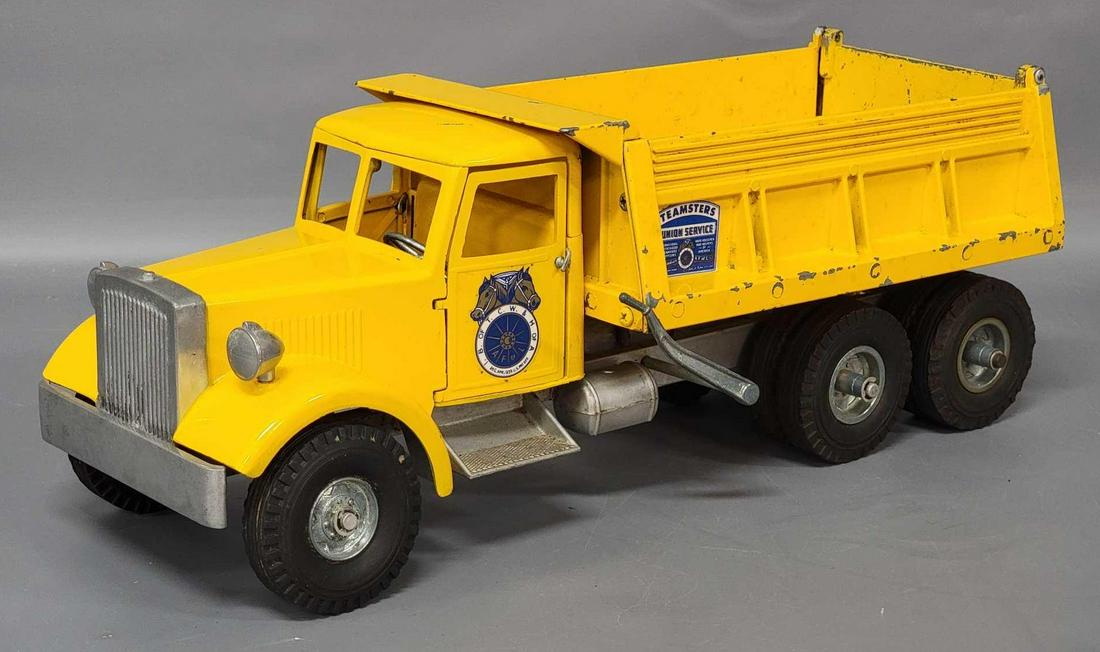 Die cast Smith Miller yellow Teamsters Union Service: Die cast Smith Miller yellow Teamsters Union Service dump truck with chips and scratches overall to truck.