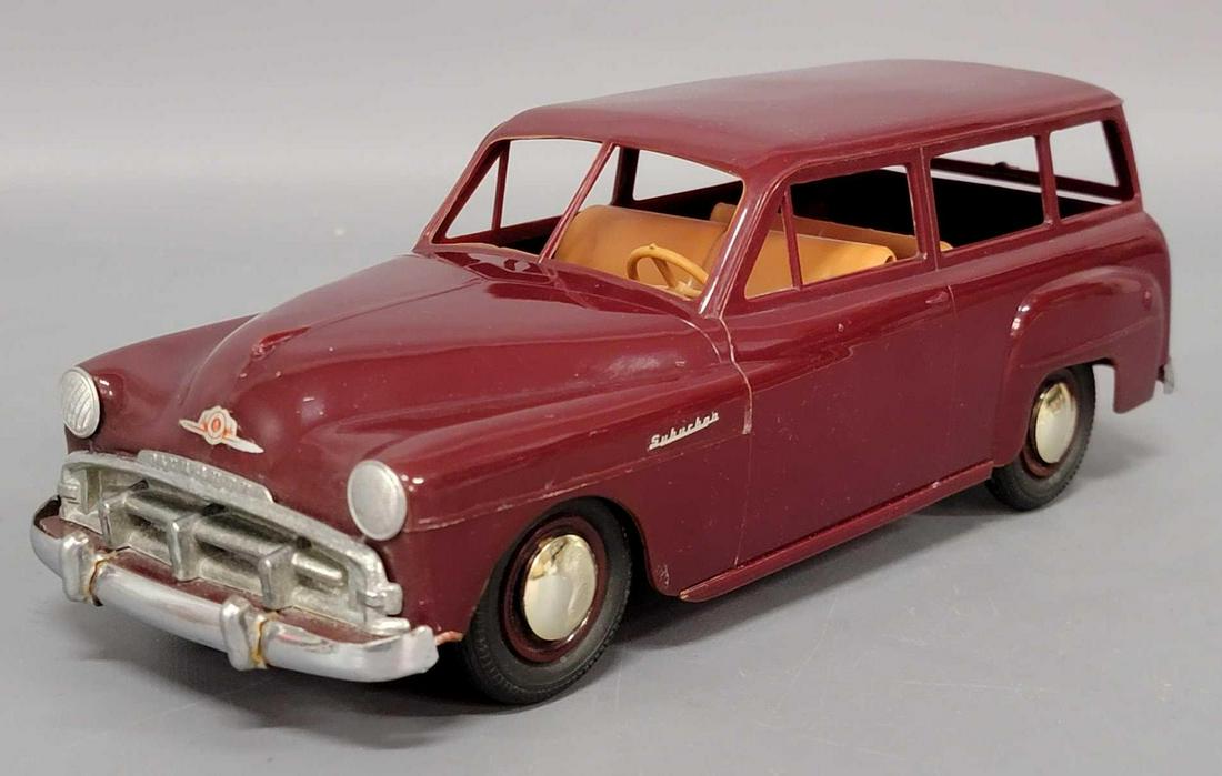 Product Miniature Co Plymouth Suburban plastic toy: Product Miniature Co Plymouth Suburban plastic toy truck. Car has what appears to be repairs to the front bumper/frame. Hubcaps have distortion? Car is very clean and shiny.