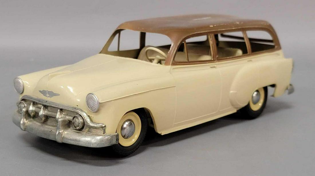 Product Miniature Co Chevrolet Handyman station wagon: Product Miniature Co Chevrolet Handyman station wagon toy. Truck has plastic warpage to roof and frame. Truck has some light play wear to some edges, some tan paint to front tires. Rear tailgate has a