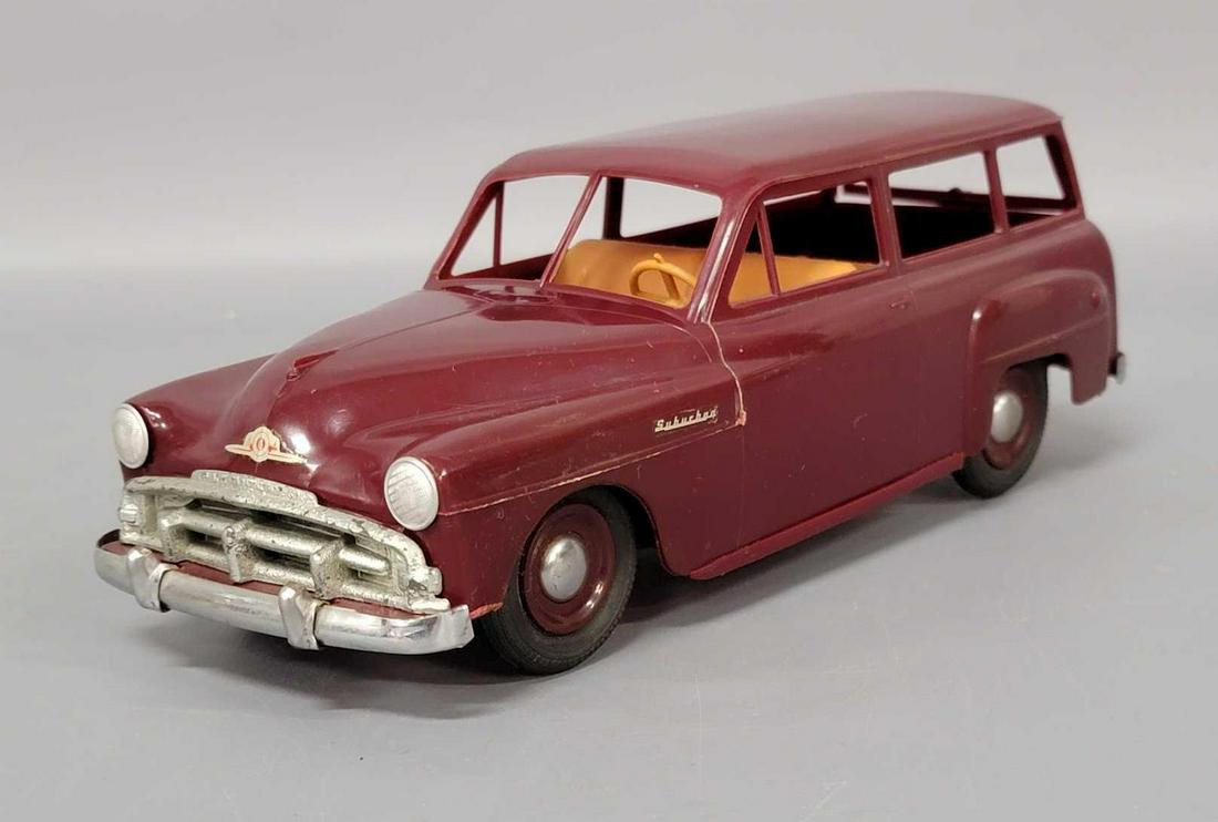 Product Miniature Co Plymouth Suburban plastic toy: Product Miniature Co Plymouth Suburban plastic toy station wagon. Truck has light play wear, crack in front of frame, oxidation on pumpers and grill, plastic warpage. Still a nice clean and shiny toy.