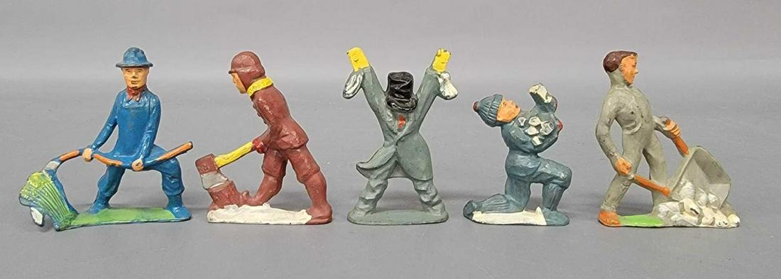 Five Manoil worker with wheel barrow farmer with sickle: Five Manoil worker with wheel barrow dumping rocks, farmer with sickle, man chopping wood, scare crow, and boy picking up firewood. Very light to very little paint wear. An excellent group of people t