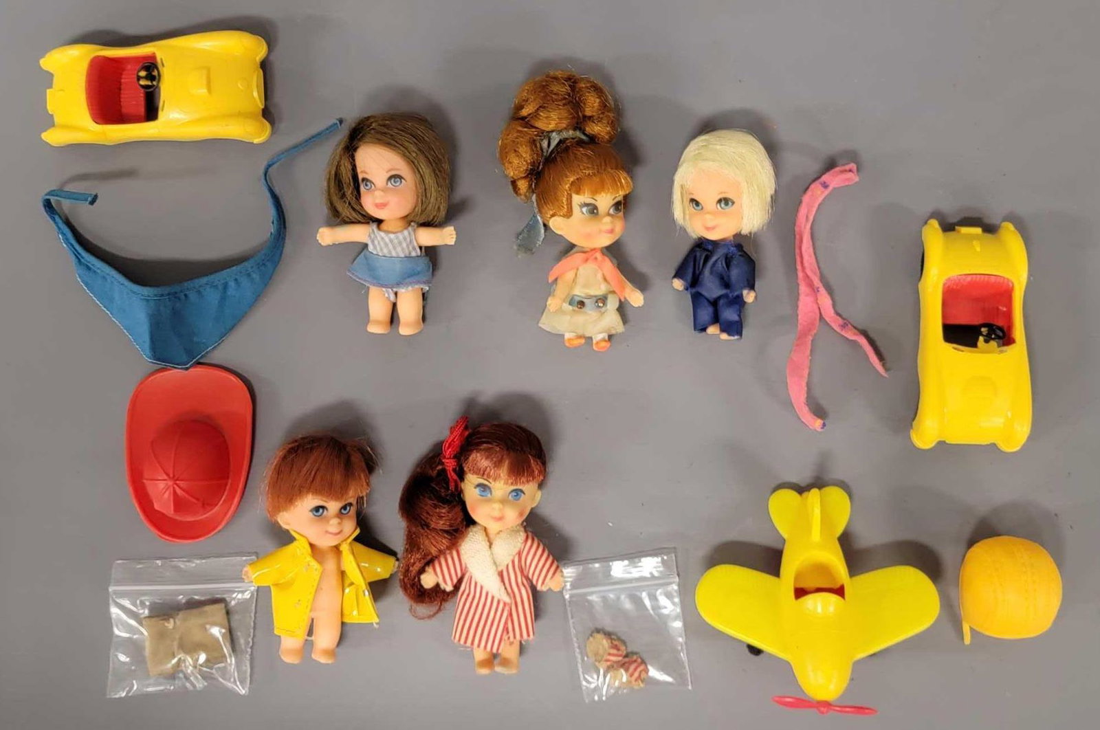 Five vintage Mattel Liddle Kiddles dolls airplane cars: Five vintage Mattel Liddle Kiddles dolls with airplane, two automobiles / cars, hats and clothes. Some dolls are identified, Kiddles in Kars Teresa Touring #67, 3514 Windy Fiddle #28, 3518 Soapy Siddl