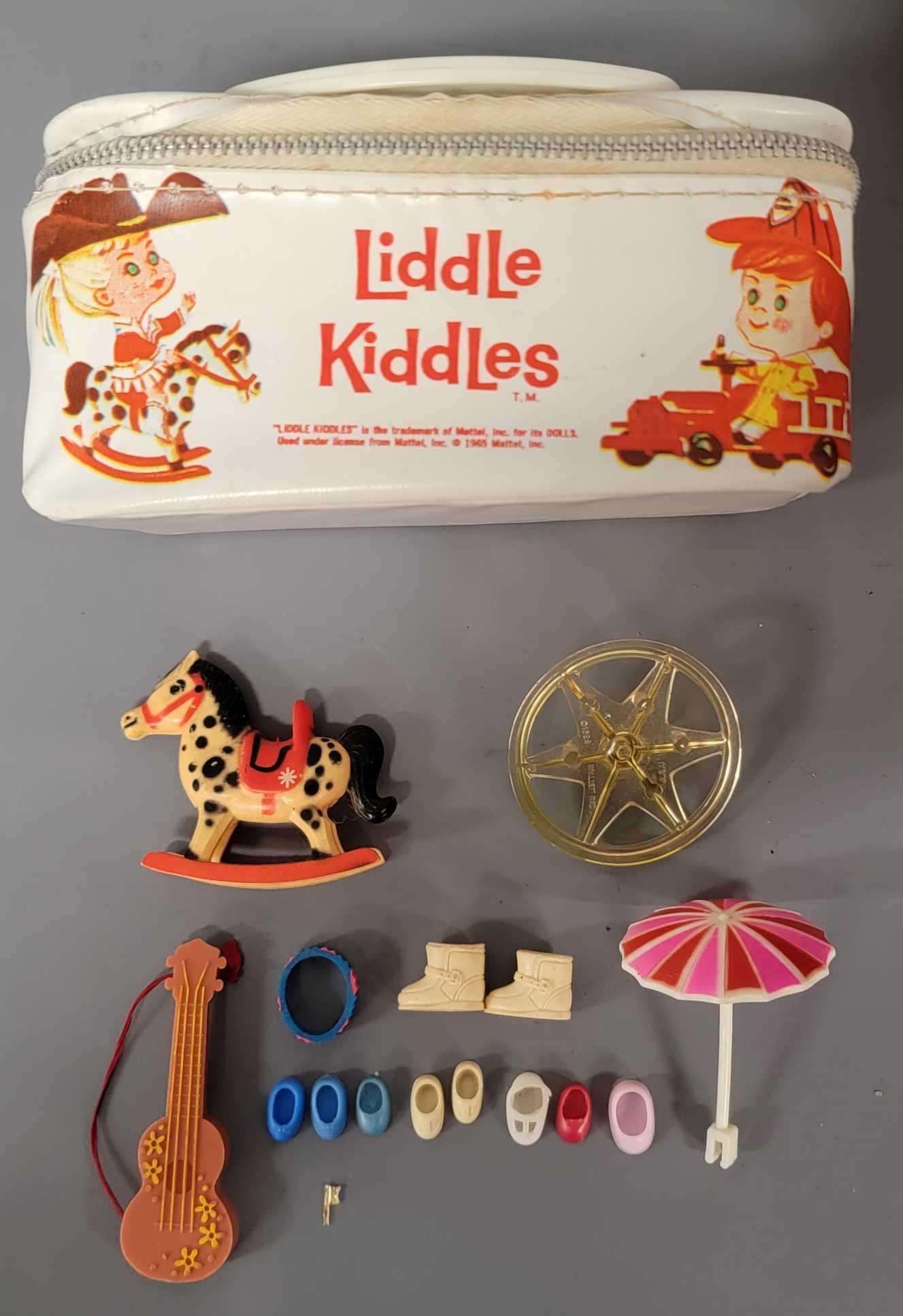 Vintage Mattel Liddle Kiddles vinyl carry case with: Vintage Mattel Liddle Kiddles vinyl carry case with shoes, boots, rocking hobby horse, and other items. Carry case has little play wear, no damage.