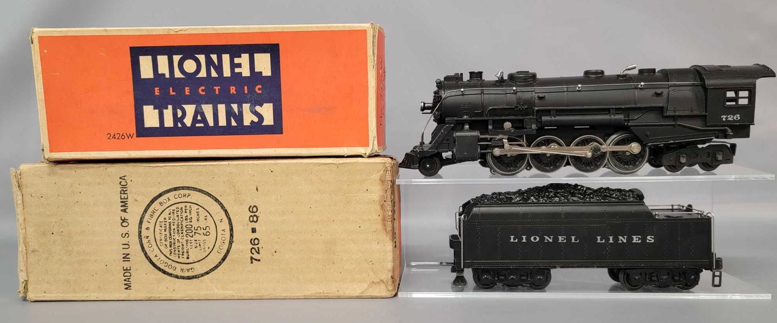 Postwar Lionel O gauge 726 and 2426 steam locomotive: Postwar Lionel O gauge 726 and 2426 steam locomotive and tender in original boxes with inserts. Baldwin drivers and Atomic Precision Motor. Loco is super nice C7 and tender is super strong C6. Trains 