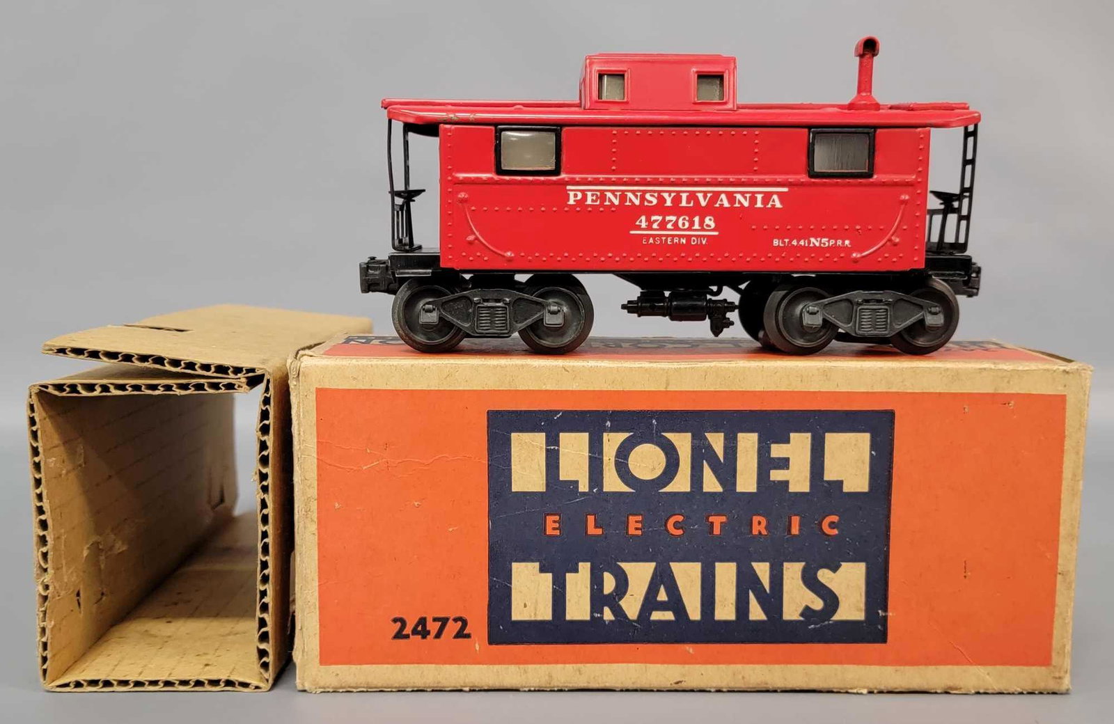 Postwar Lionel O gauge 2472 Pennsylvania N5 caboose in: Postwar Lionel O gauge 2472 Pennsylvania N5 caboose in original box with insert, super strong C7. Early production with flying shoe. Minor wear, tear, inner paper tape repairs, otherwise square and so