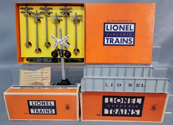 Postwar Lionel O gauge 150 telegraph poles 154 crossing: Postwar Lionel O gauge 150 telegraph pole set, 154 automatic road crossing signal and 314 plate girder bridge in original boxes, C9. Boxes show light wear, square and solid.