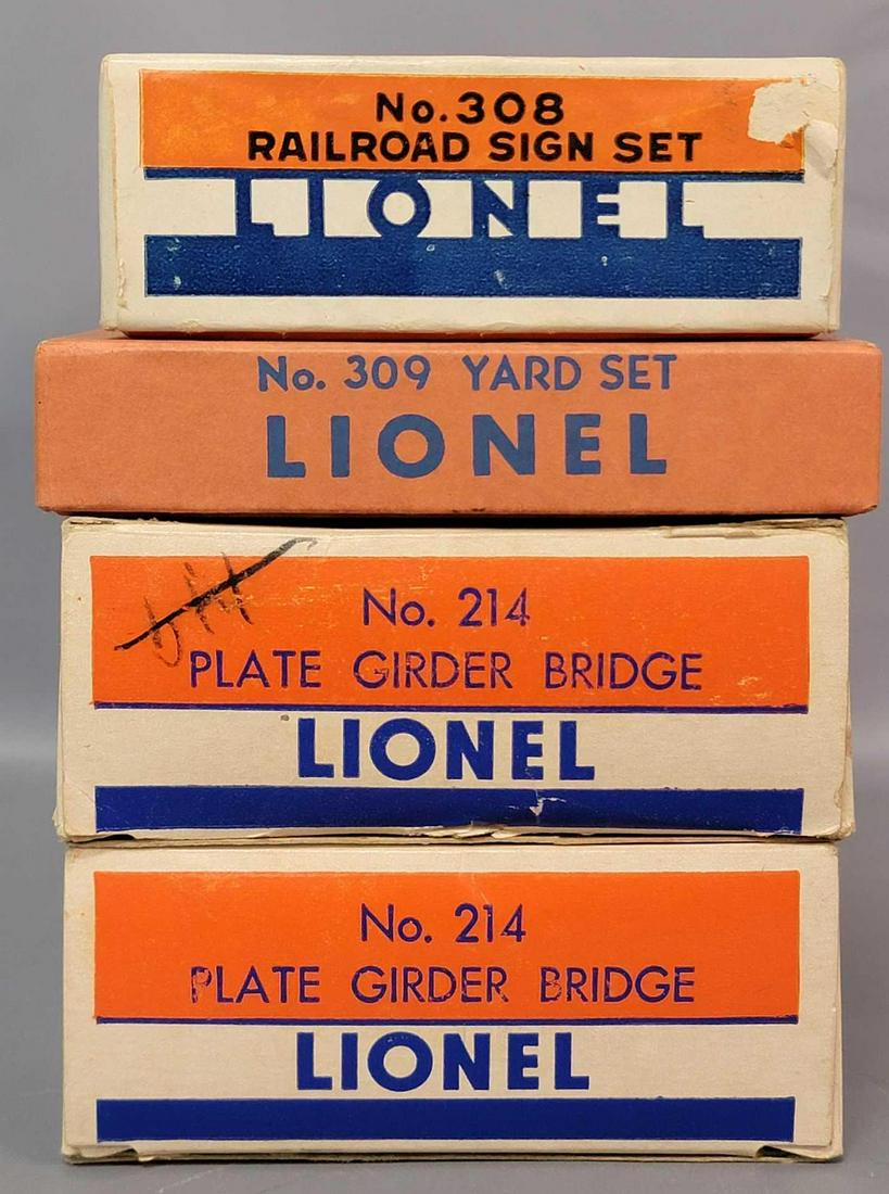 Postwar Lionel O gauge 214 214 308 309 accessories in: Postwar Lionel O gauge accessories in original boxes, C6-8 range. Boxes have light wear, tears, tape repairs, writing. Boxes are still bright, clean, square, and solid.