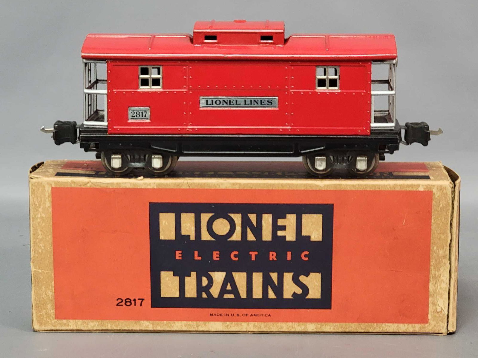 Prewar Lionel O gauge 2817 caboose in original box: Prewar Lionel O gauge 2817 caboose in original box, very clean and shiny C7. Box has wear, tear, repairs, to flap folds, otherwise square and solid.