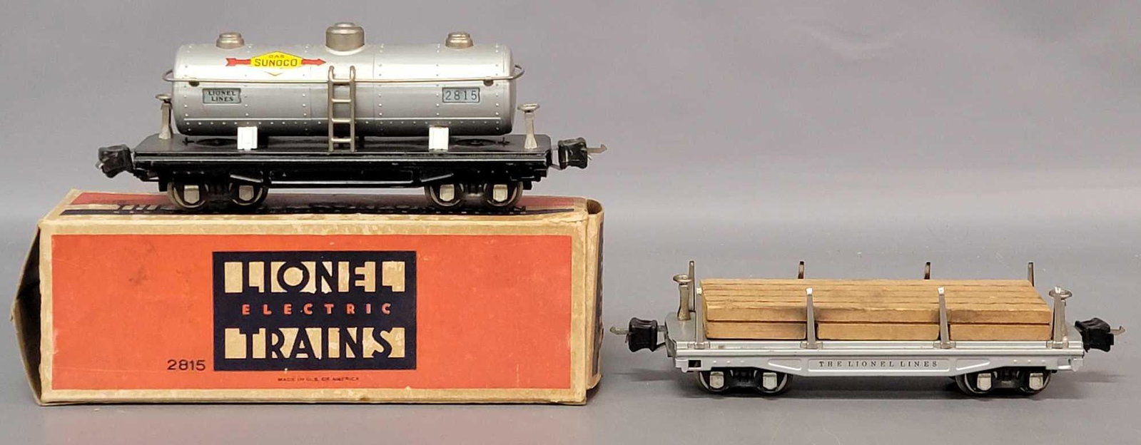 Prewar Lionel O gauge 2811 flat car with lumber and: Prewar Lionel O gauge 2811 flat car with lumber and 2815 Sunoco tank car, much nicer strong C6, 2815 box has missing inner flap, otherwise a nice box.