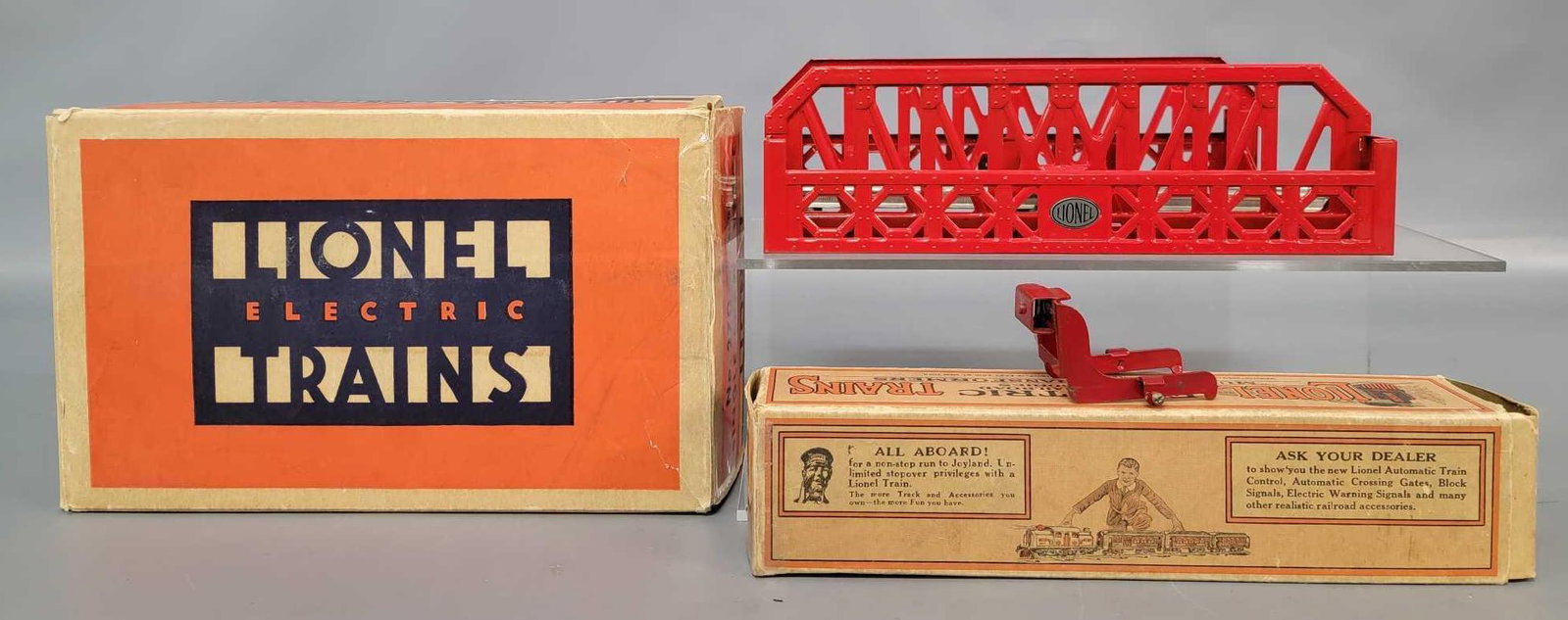 Prewar Lionel O gauge 270 single bridge span and 023: Prewar Lionel O gauge 270 single bridge span with 023 bumper in original boxes. Bridge has a track section installed, looks C8. Bumper is very clean and shiny C6. Boxes are very square and solid with 