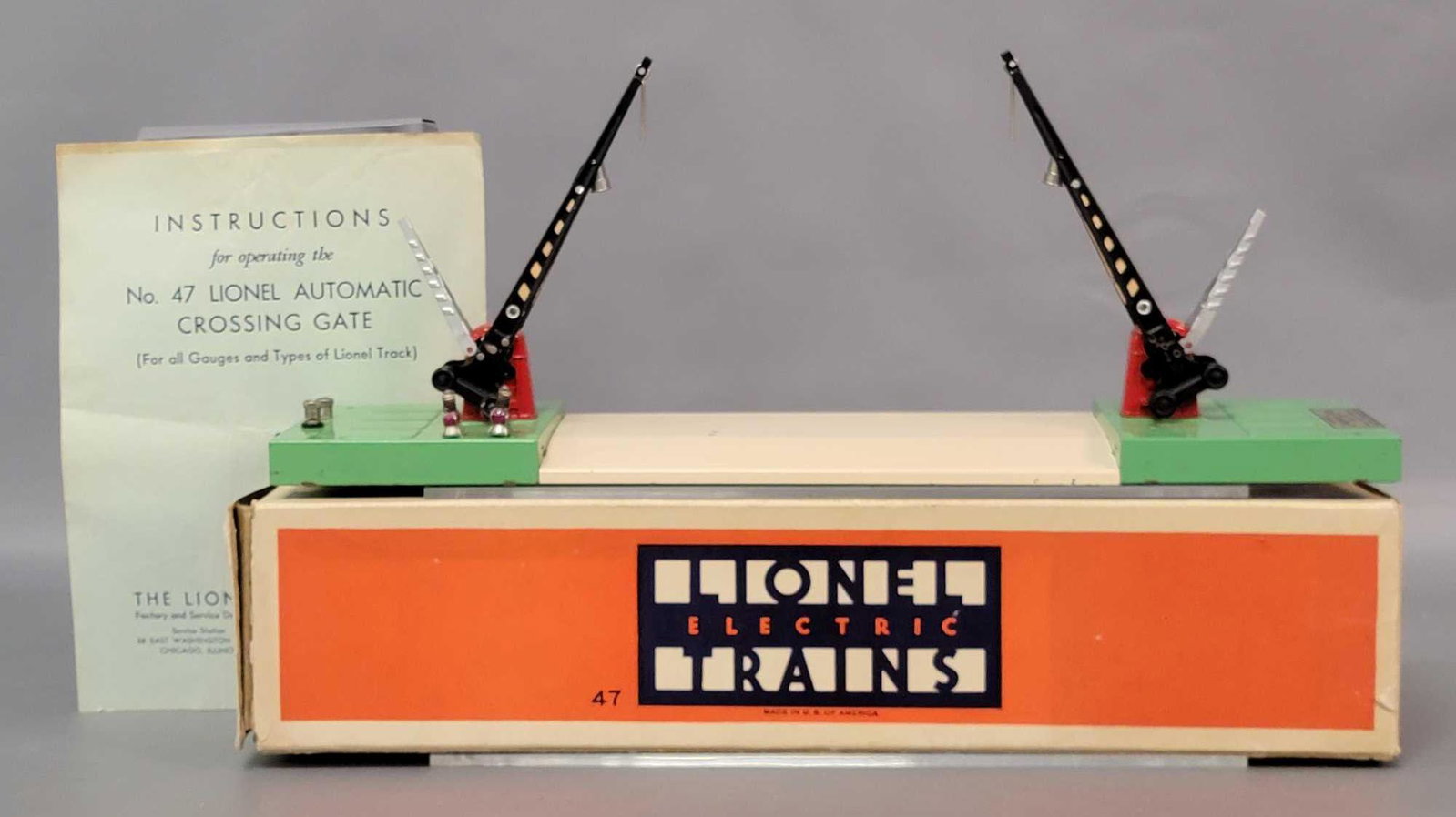 Prewar Lionel O gauge 47 automatic crossing gates in: Prewar Lionel O gauge 47 automatic crossing gates in original box with insert, very light wear to roadway area, C7. Box has duct tape to and end flap and inner repairs to other end, missing inner flap
