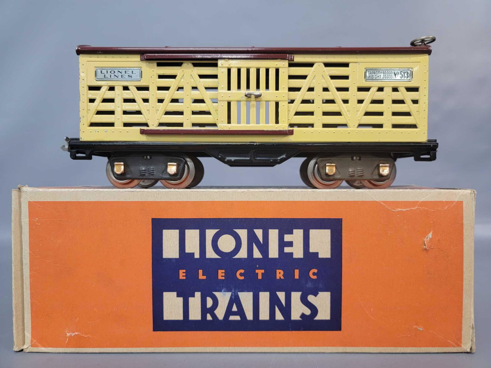 Prewar Lionel Standard Gauge 513 cattle car in original: Prewar Lionel Standard Gauge 513 cattle car with copper journals, really clean and shiny C6. Box has a missing inner flap and inner coupler protection flap to one end, otherwise a very square and soli