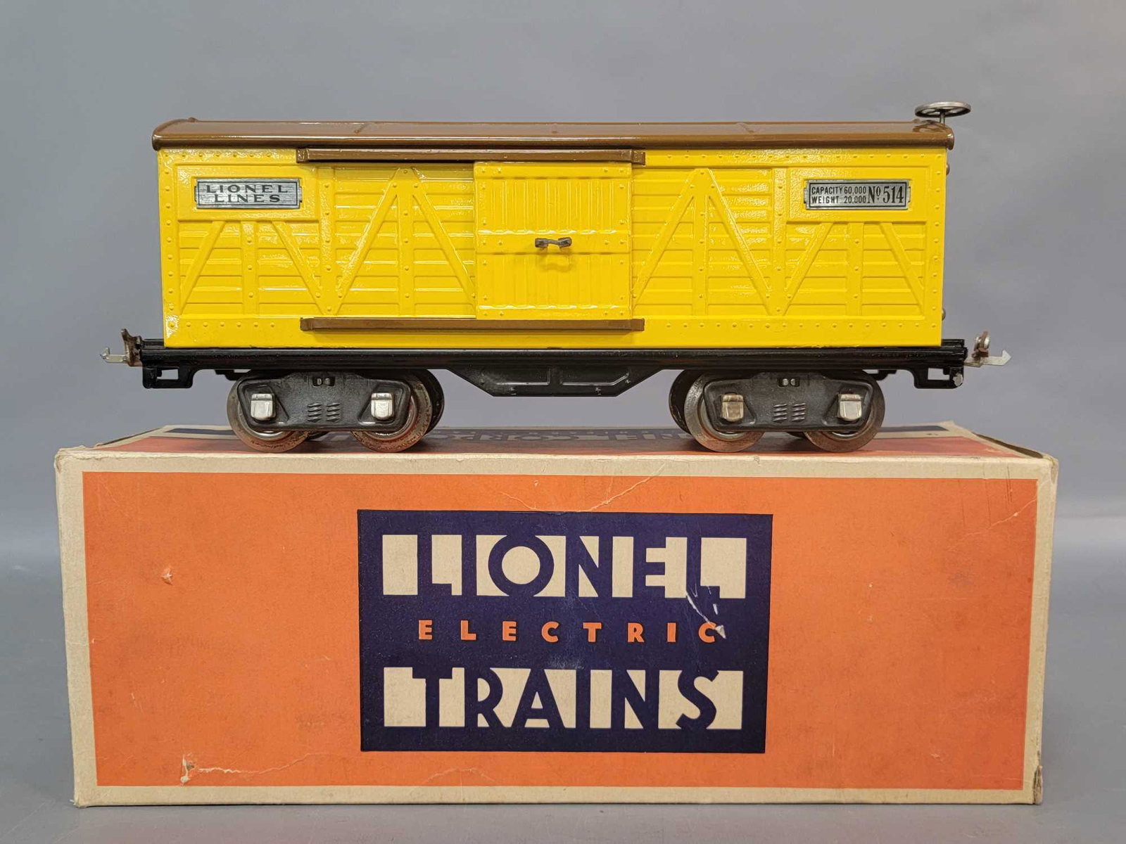 Prewar Lionel Standard Gauge 514 box car in original: Prewar Lionel Standard Gauge 514 box car. Train has a spot of marring to paint on roof. Train looks a much better grade, but has surface rust on wheels and couplers, C6. Box has light wear and tear, o