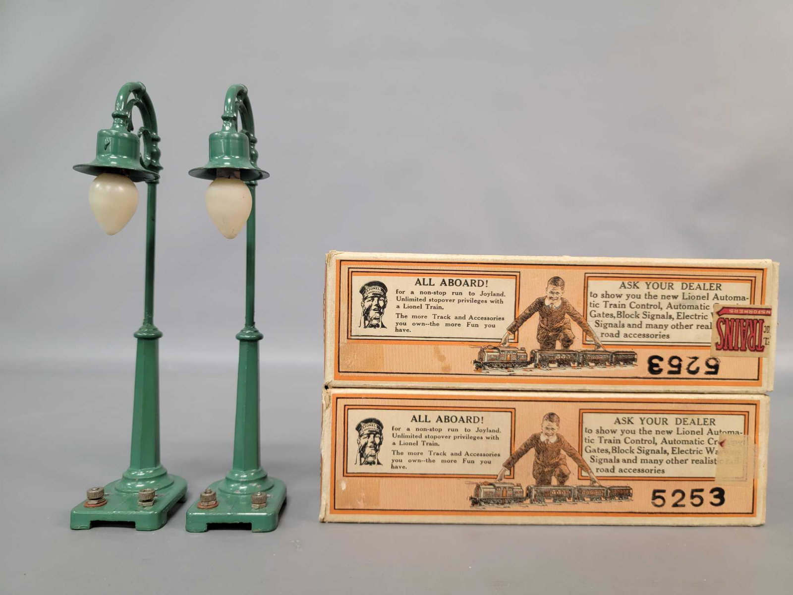 Prewar Lionel 58 lamp posts in original boxes: Prewar Lionel 58 lamp posts in original boxes, lamps are much nicer than normally seen, C7. Boxes are very square and solid with nice solid graphics and some interesting ink stamps.