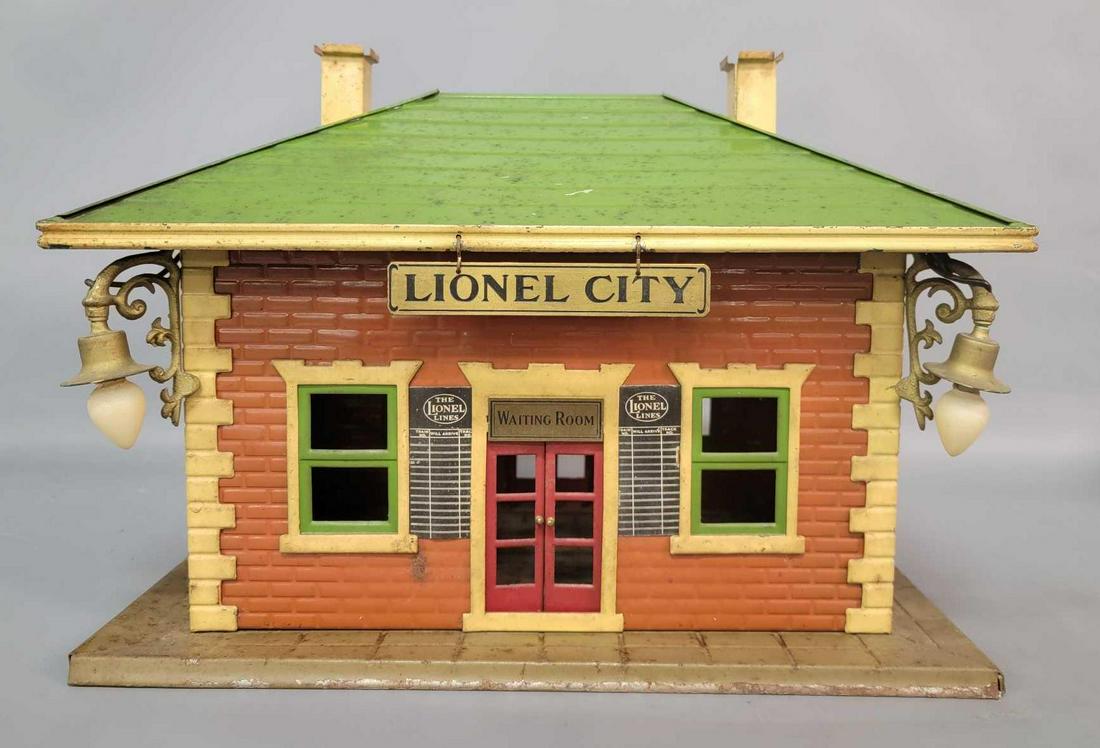 Prewar Lionel City Standard Gauge 124 Station with: Prewar Lionel City Standard Gauge 124 Station with brass plate and gold lamps, mojave base, tuscan body, green window inserts, cream stone work and chimneys, green roof. Station should clean and polis