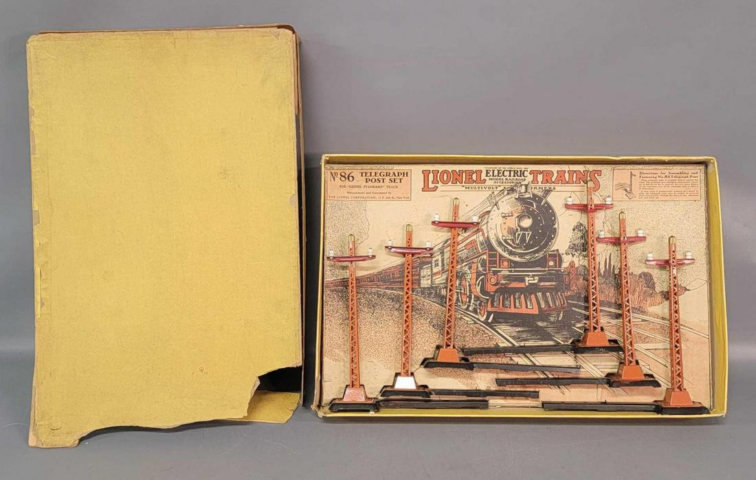 Prewar Lionel Standard Gauge 86 telegraph post set in: Prewar Lionel Standard Gauge 86 telegraph post set in original box, beautiful C6 set. No missing porcelain insulators. Box lid flaps have been paper tape repaired, but has detached flaps, and all may 