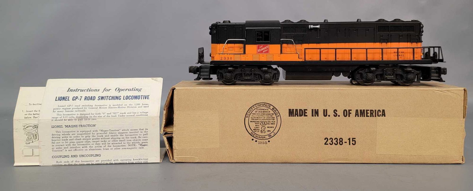 Unrun Postwar Lionel O gauge 2338X solid stripe The: Postwar Lionel O gauge 2338X solid stripe The Milwaukee Road GP-7 in original box, unrun exceptionally clean C8. Box is a minty Brick. Includes two instruction sheets as seen in the photos..