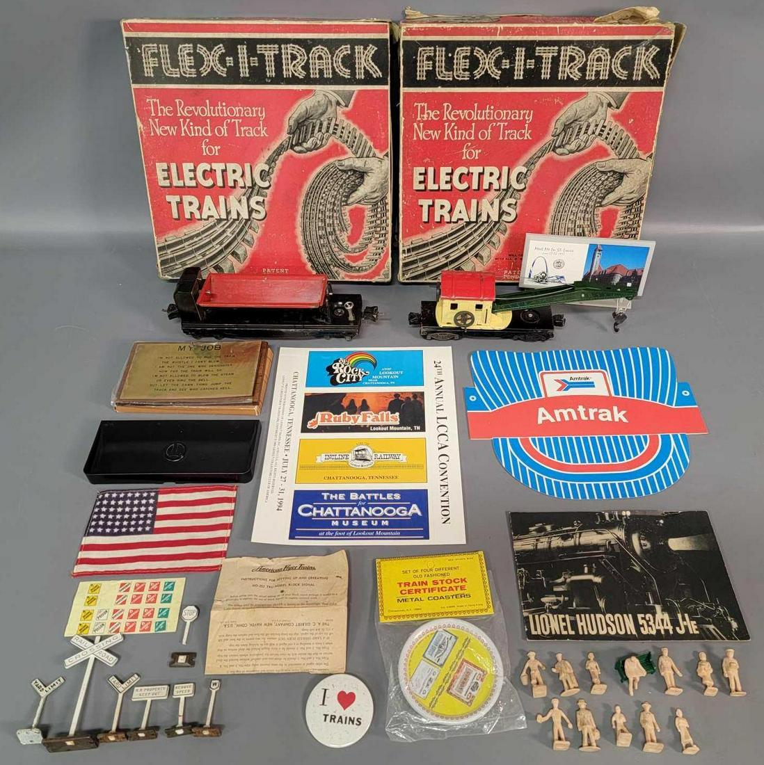 Prewar and postwar Lionel O gauge 2560 3859 railroad: Prewar and postwar Lionel O gauge 2560 derrick, 3859 remote control dump car, railroad signs, 700E Hudson booklet in good condition, 160 bin, two complete sections of Flex-I-Track in original boxes, a
