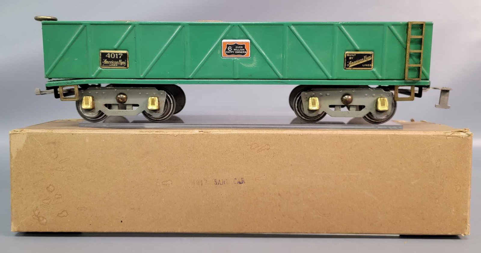 Prewar American Flyer Wide Gauge 4017 sandcar green in: Prewar American Flyer Wide Gauge 4017 sand car green, gray painted truck frames, black painted drawbar frames, brass plates and trim, aluminum Over 6 Million Happy Owners plates, one corner of frame i